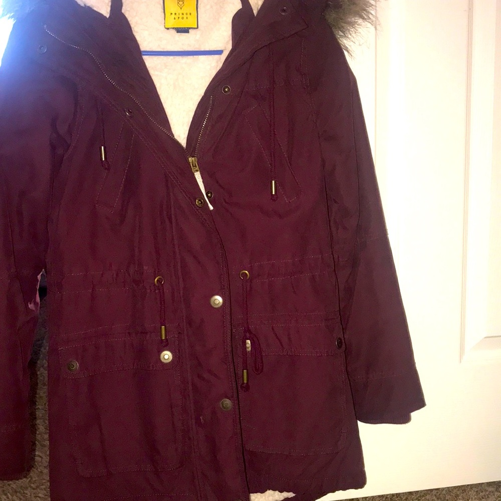 A jacket it’s burgundy it’s still in good conditions